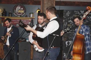 The Slocan Ramblers, Adrian Gross on mandolin, Frank Evans on banjo, Darryl Poulsen on guitar and Alastair Whitehead on bass, rocked The Crossing Pub on Saturday in night in Sharbot Lake. Photo/Craig Bakay
